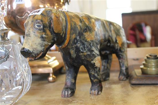 Carved and painted folk art dog with brindled coat